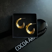 COCOA ARI gold demi-fine hoop earrings in black jewelry box with branded ribbon
