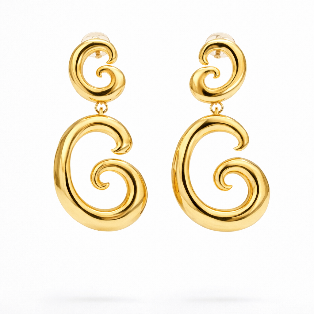 Gold swirl drop earrings by COCOA ARI, modern small-batch demi-fine jewelry on white background