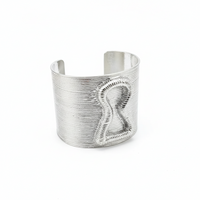 Silver cuff bracelet on a dark surface with 'Add to cart' and 'Buy now' buttons.