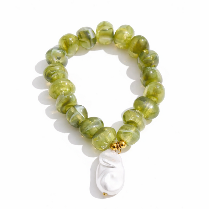 Green beaded bracelet with a white pearl charm