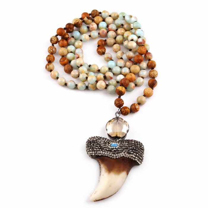 Necklace with beads and a large toth pendant