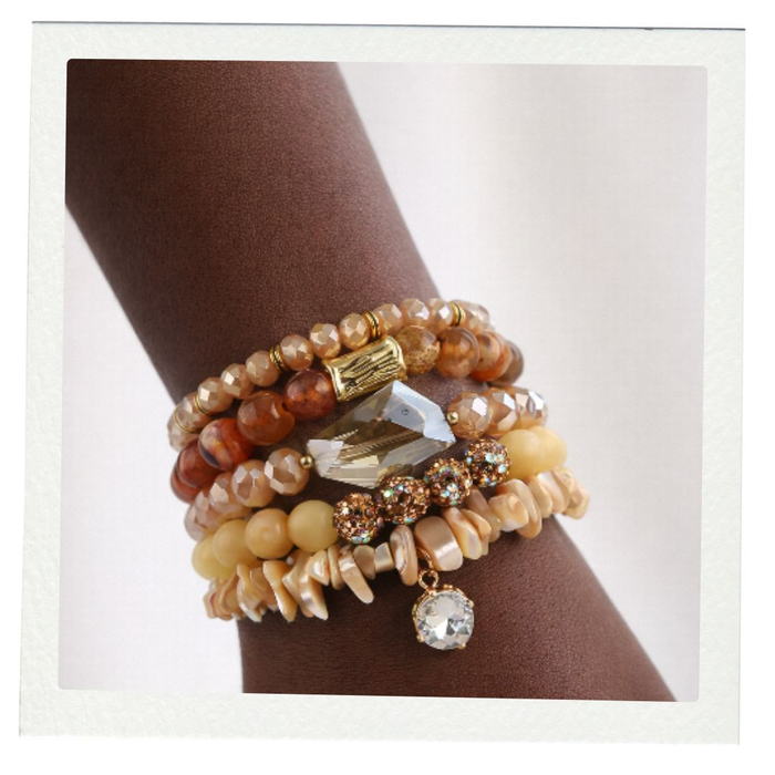 Stack of beaded bracelets on a wrist 