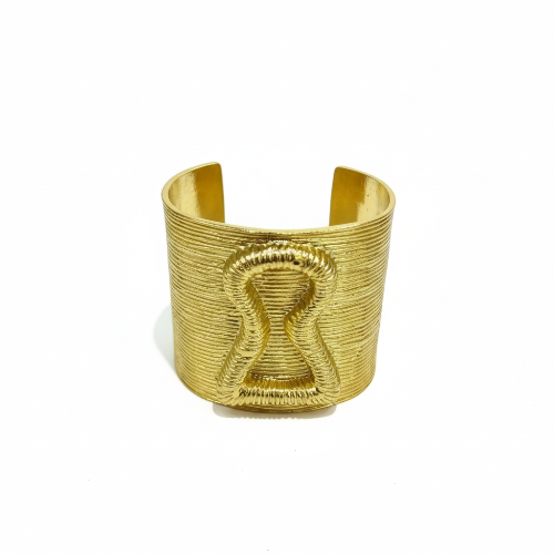 Gold bracelet on a magazine with 'Add to cart' and 'Buy now' buttons.