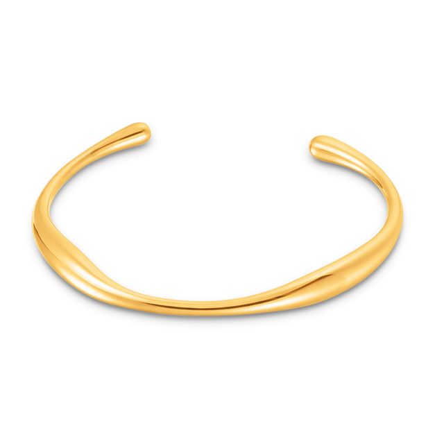 Gold bangle on a white background