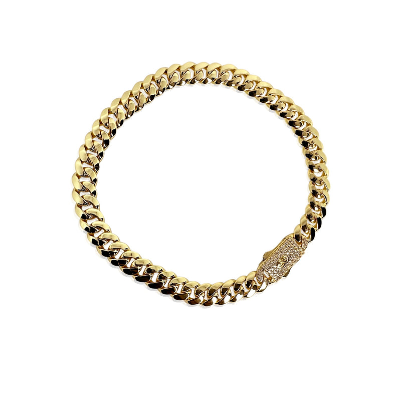 gold cuban with cz bezel on white background