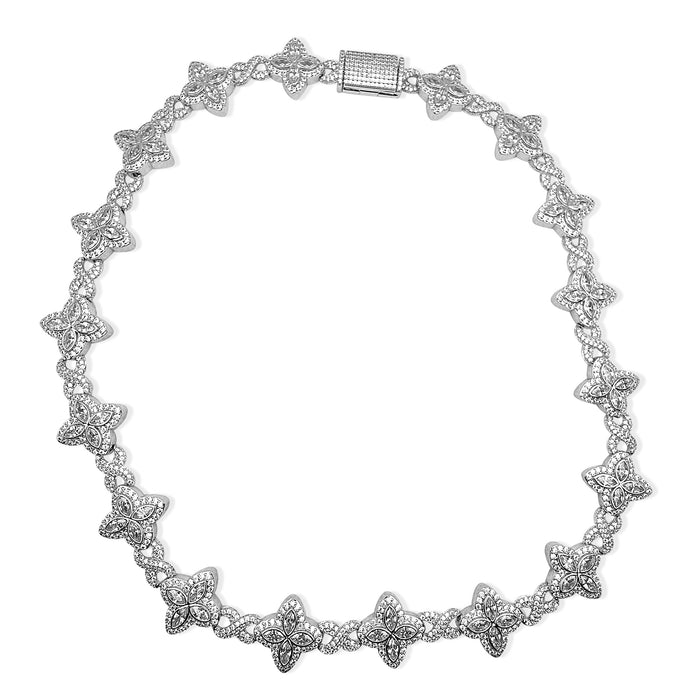 Silver necklace with star-like designs on a white background