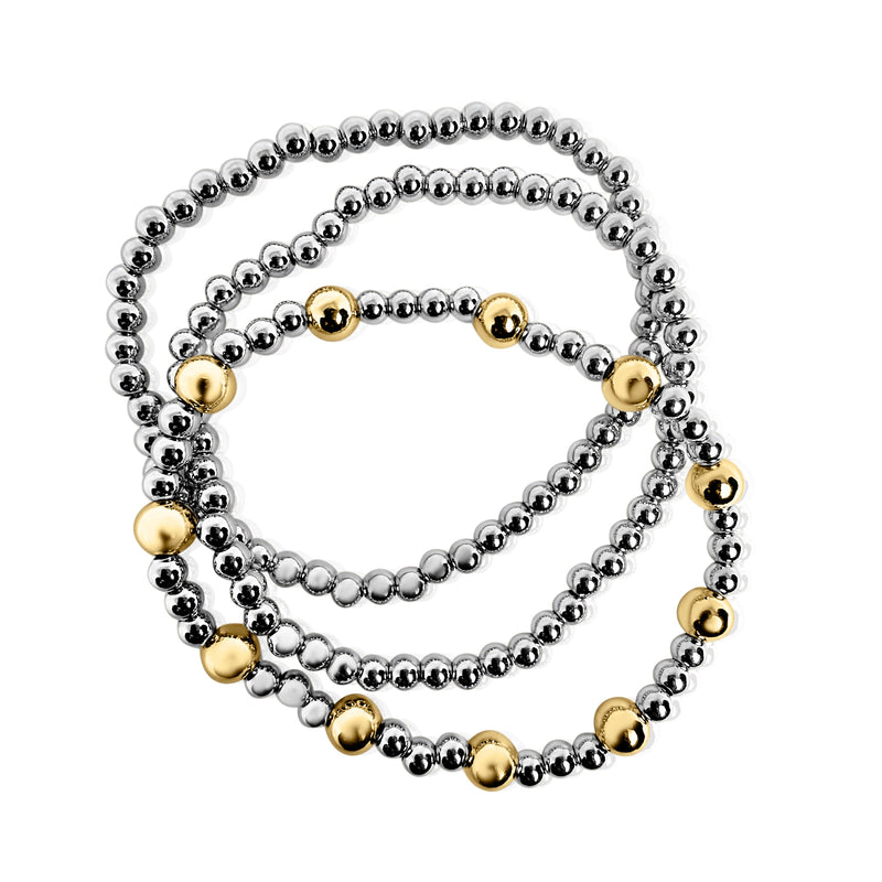 Set of three beaded bracelets in silver, gold, and bronze on a white background
