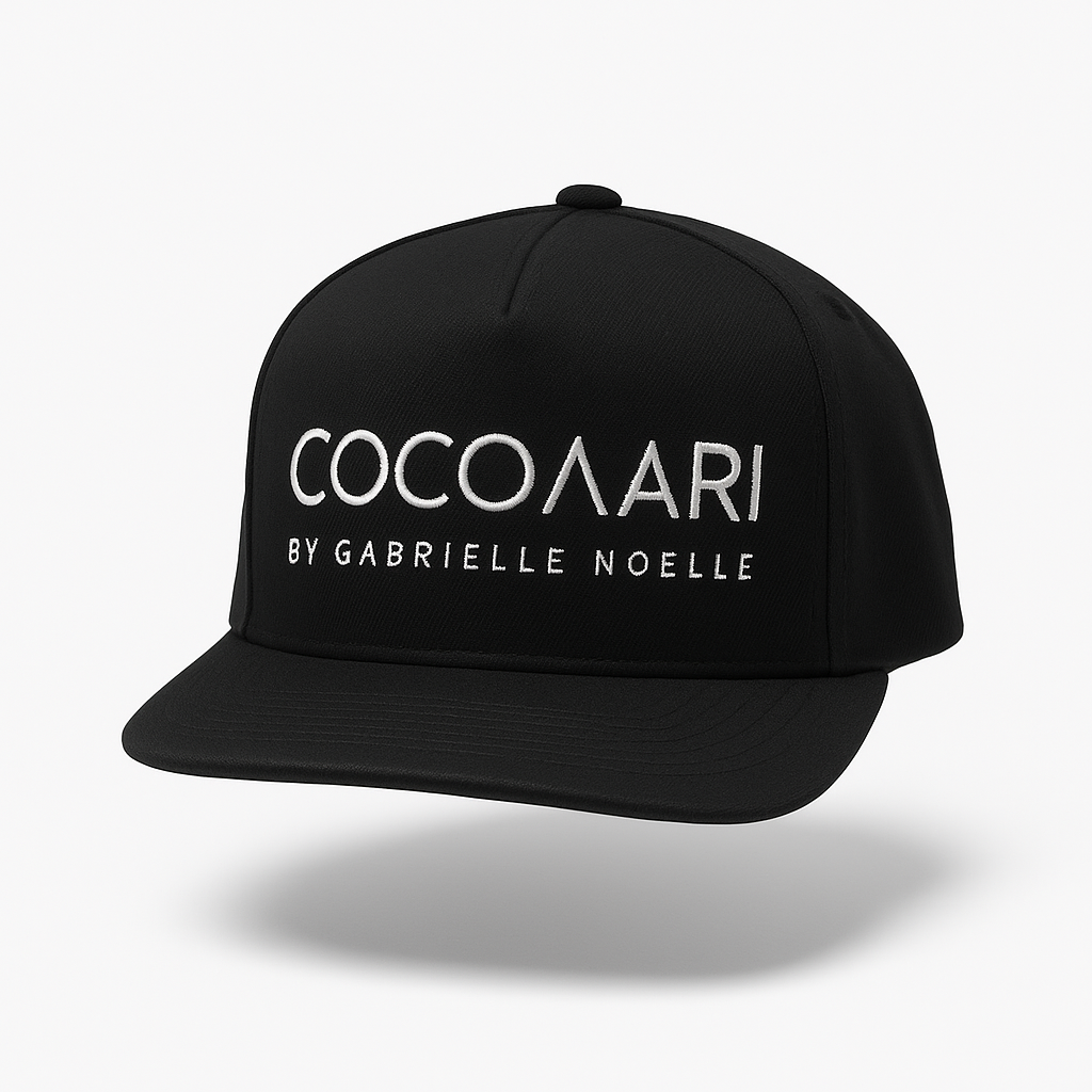 Black cap with 'COCOARIA by Gabrielle Noelle' text on a white background