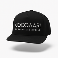 Black cap with 'COCOARIA by Gabrielle Noelle' text on a white background