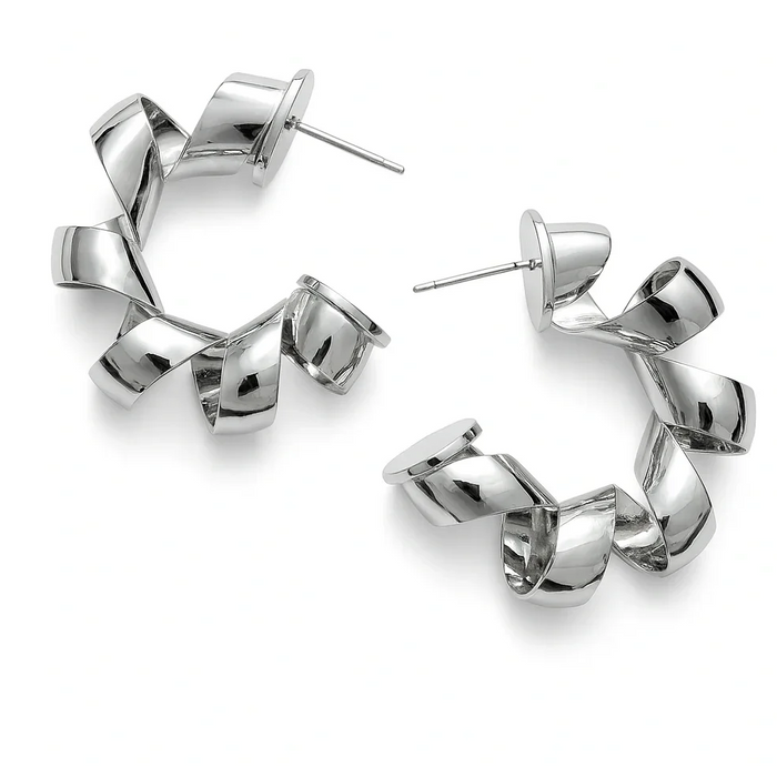 Cocoa Ari silver twisted hoop earrings, modern demi-fine jewelry on white background