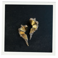Gold fan earrings with cz diamond around the sides