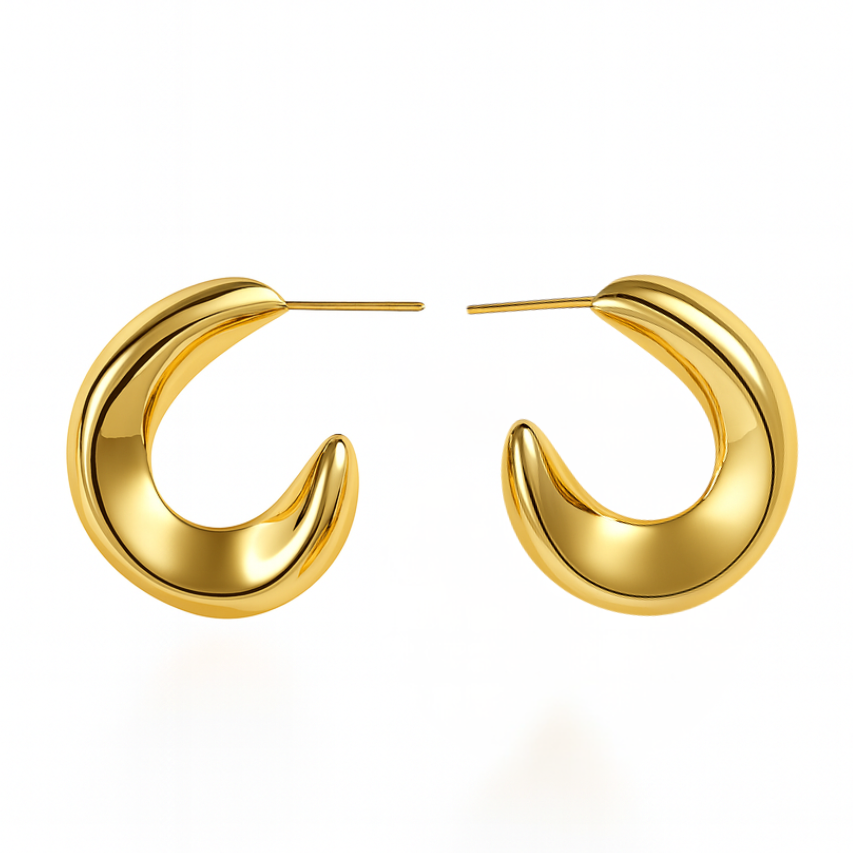 Gold hoop earrings on a white background