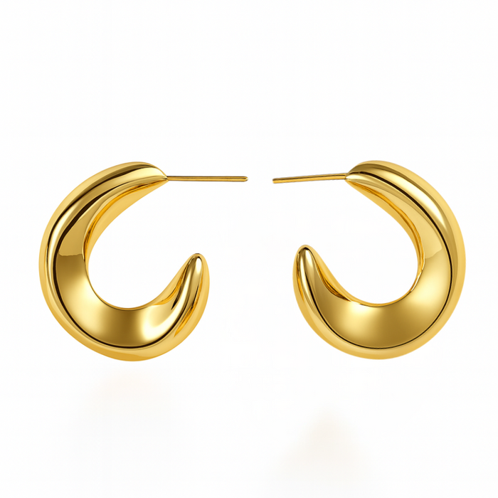 Gold hoop earrings on a white background