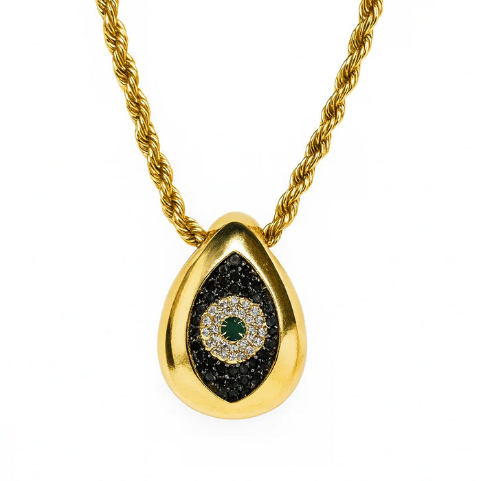 Gold necklace with a teardrop-shaped pendant featuring black and green gemstones on a white background