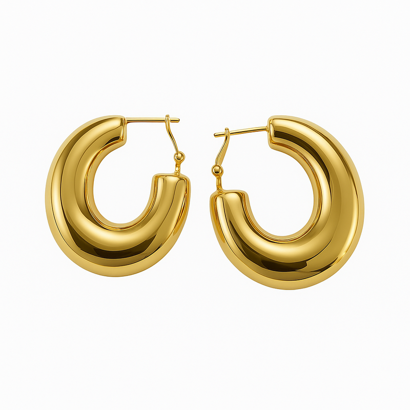 Gold hoop earrings on a white background