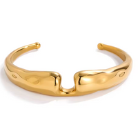 Gold bracelet on a white background