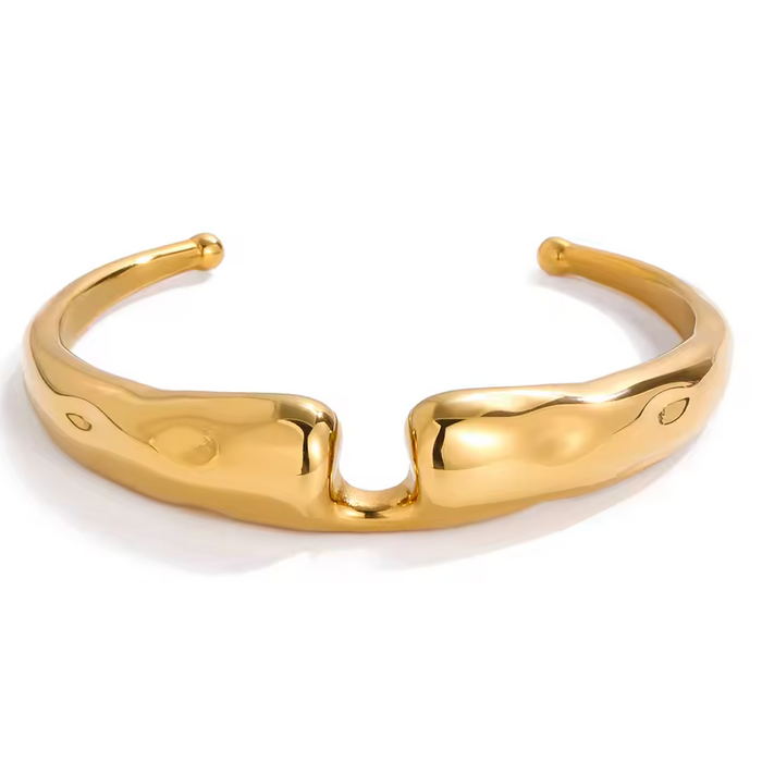 Gold bracelet on a white background