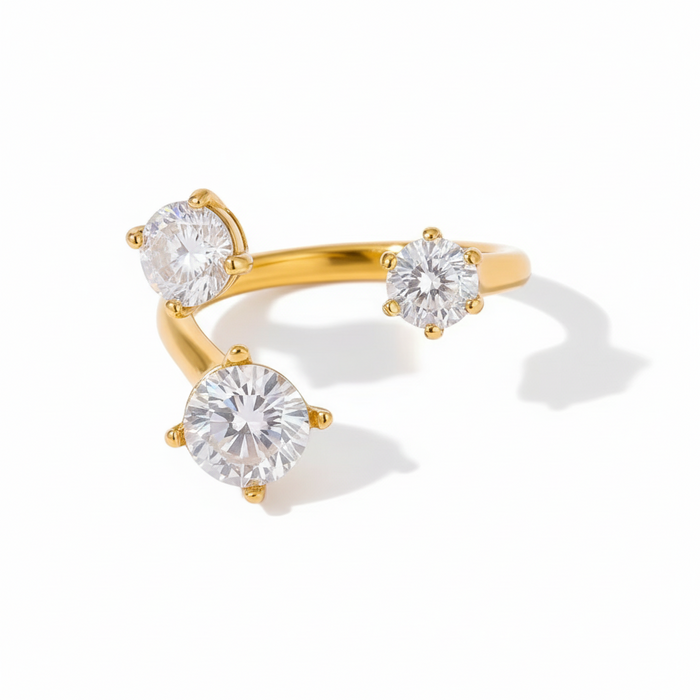 Gold ring with clear stones on a white background