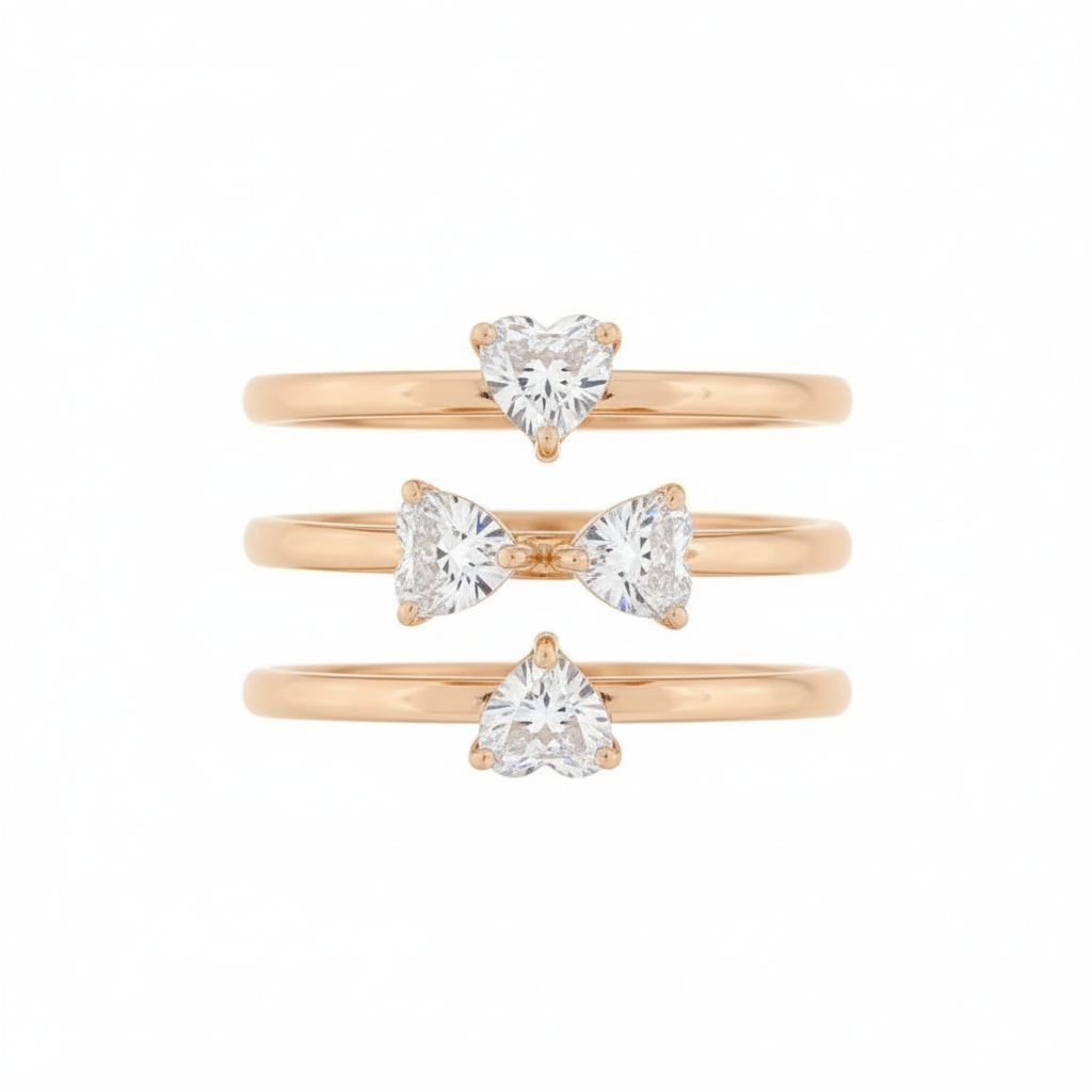 Gold rings with heart-shaped gemstones on a product page.