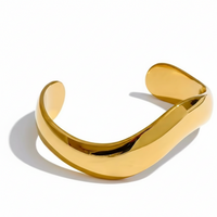 Gold bracelet on a white background
