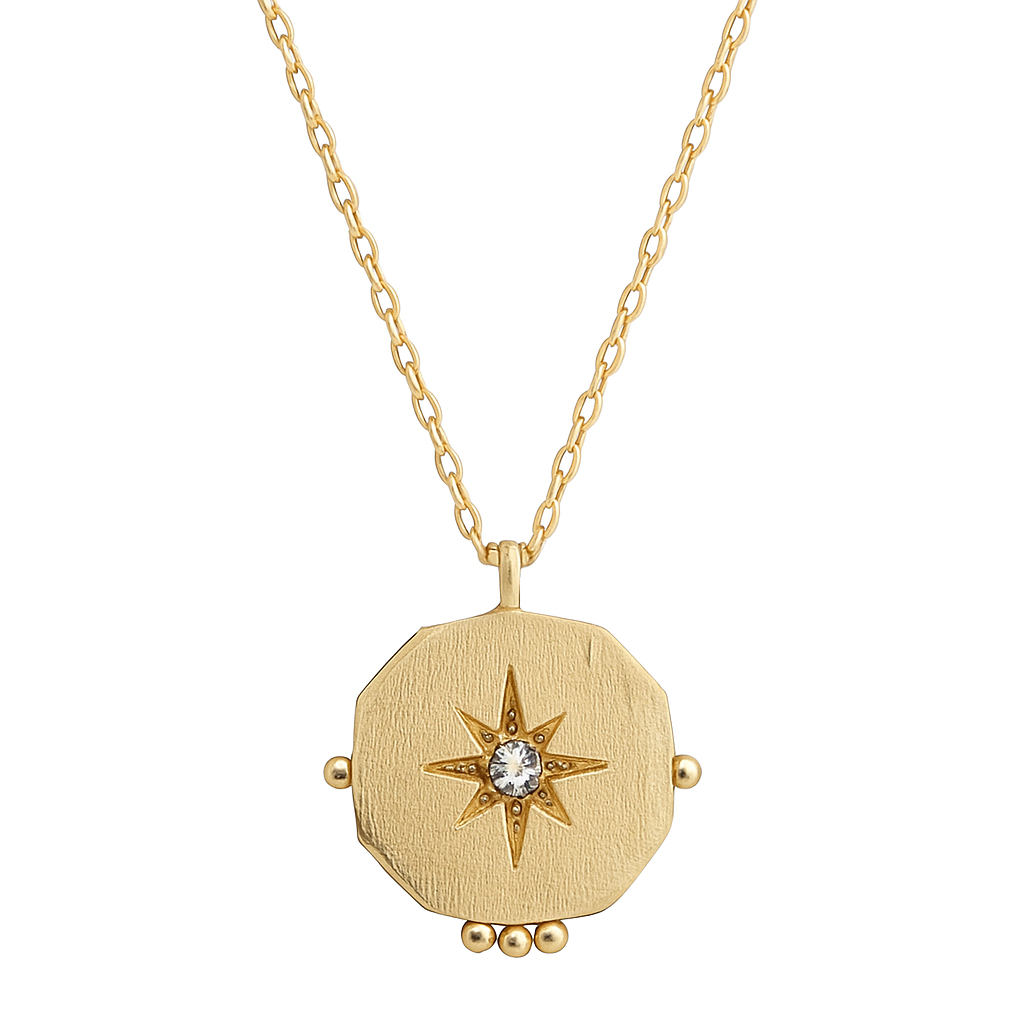 Gold necklace with a star-shaped pendant on a white background