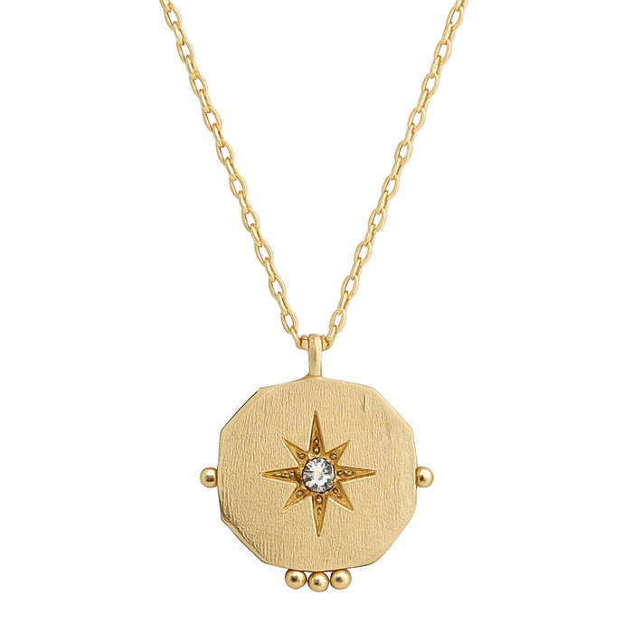 Gold necklace with a star-shaped pendant on a white background