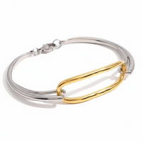 Silver and gold bracelet on a white background with 'Add to cart' button.