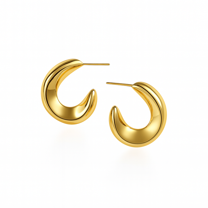 Gold hoop earrings on a white background