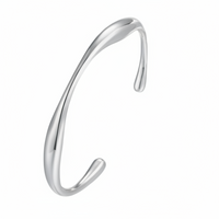 Silver wavy bangle on a white background