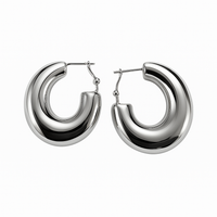 Pair of silver hoop earrings on a white background