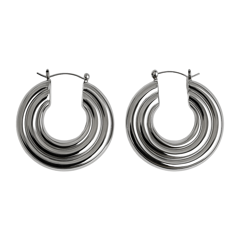 Pair of silver spiral hoop earrings on a white background