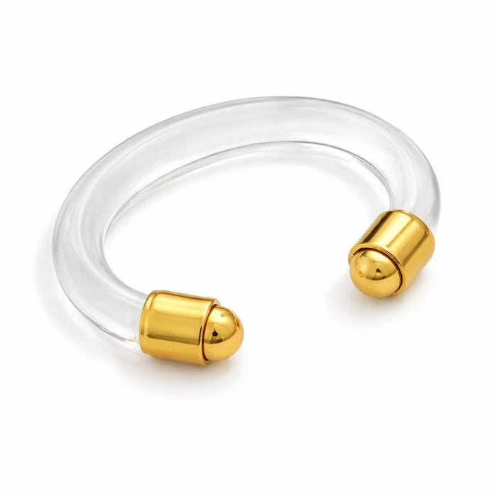 Clear bracelet with gold ends on a white background