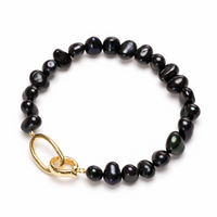 Black pearl bracelet with a gold clasp 