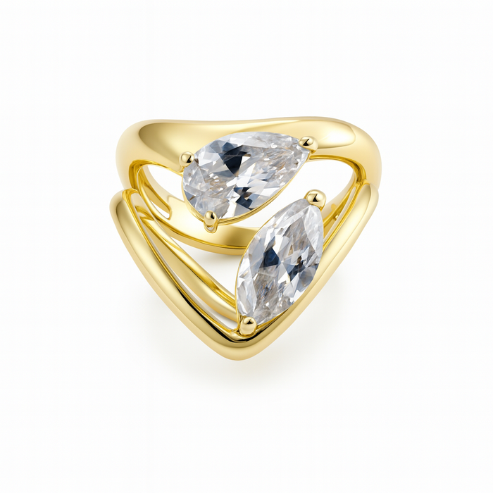 Gold ring with two clear gemstones on a white background